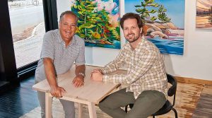 two men sitting at a table